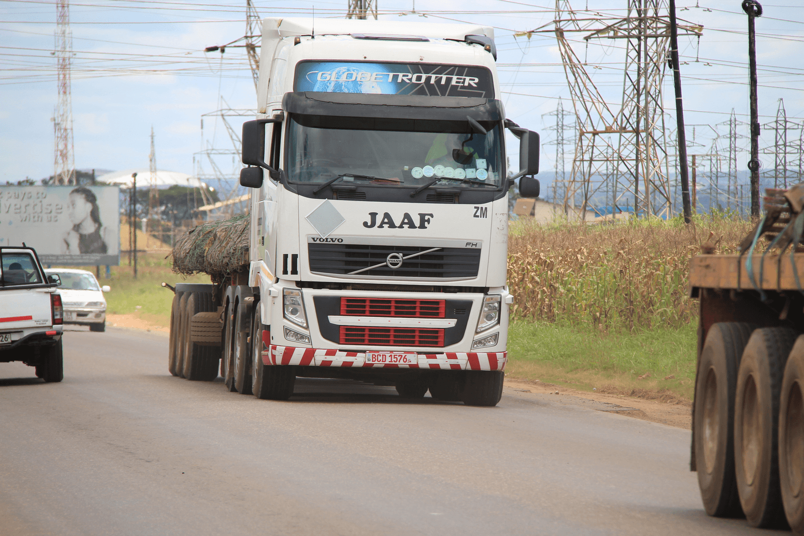 A JAAF Volvo truck carrying a loaded trailer on the road