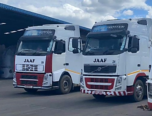 A pair of JAAF trucks yarded between runs